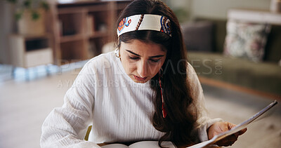 Buy stock photo Student, woman and studying in home with book for test preparation, thesis or knowledge. Learning, education and serious person in living room for college assignment, project and reading information