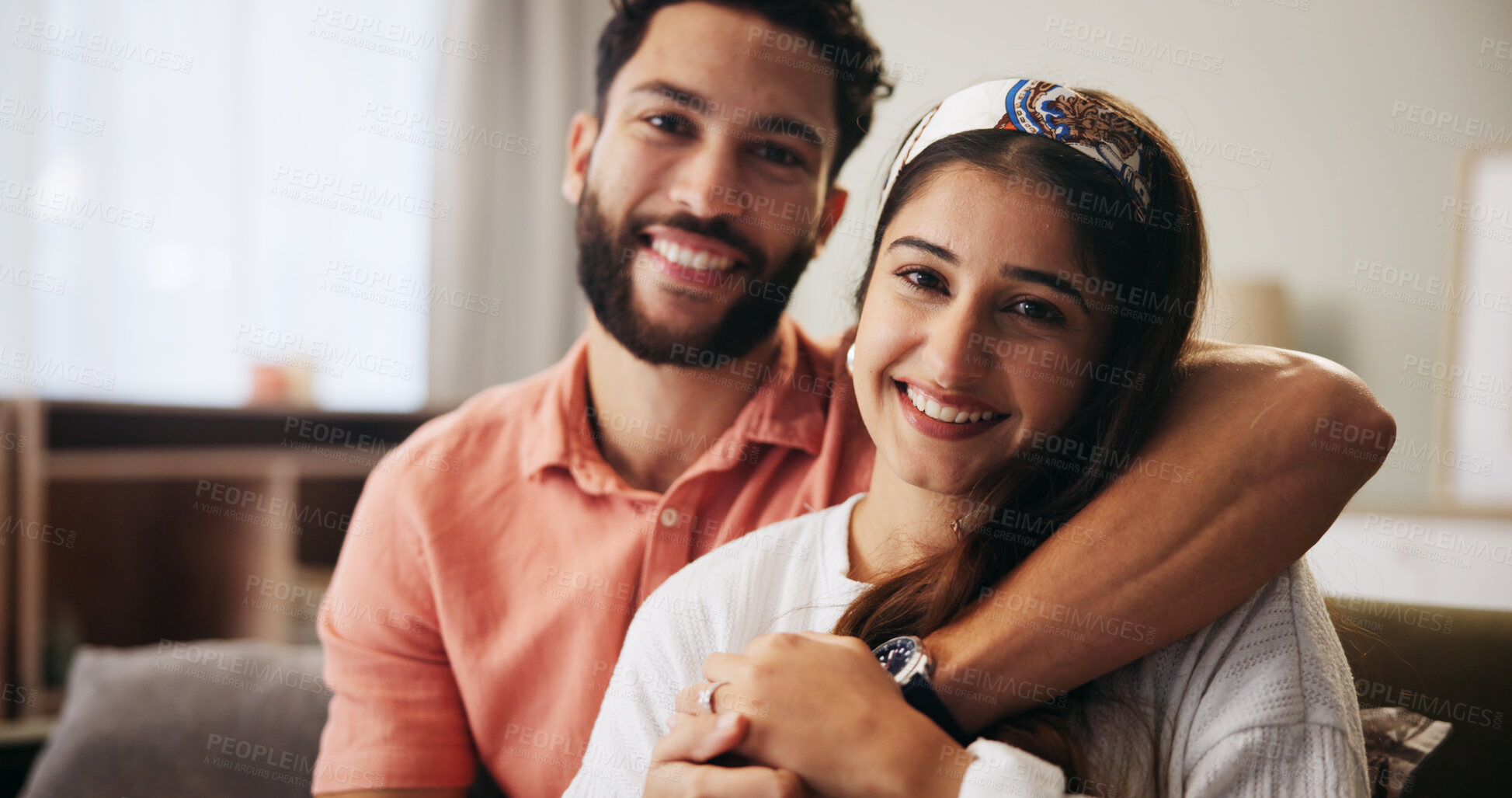 Buy stock photo Hug, couple and portrait in living room with smile, bonding and weekend date in apartment. Embrace, happy man and woman with love in house for relationship, joy or care in home lounge for break