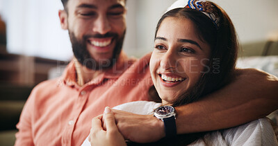 Buy stock photo Hug, happy couple and smile in living room with love, bonding and weekend date in apartment. Embrace, man and woman in house for marriage relationship, laugh or funny joke in home lounge for break