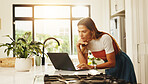 Typing, laptop and woman in kitchen, home and planning for blog on social media, online or creative. Apartment, writer and person with tech for post on website, blogger and remote work in house