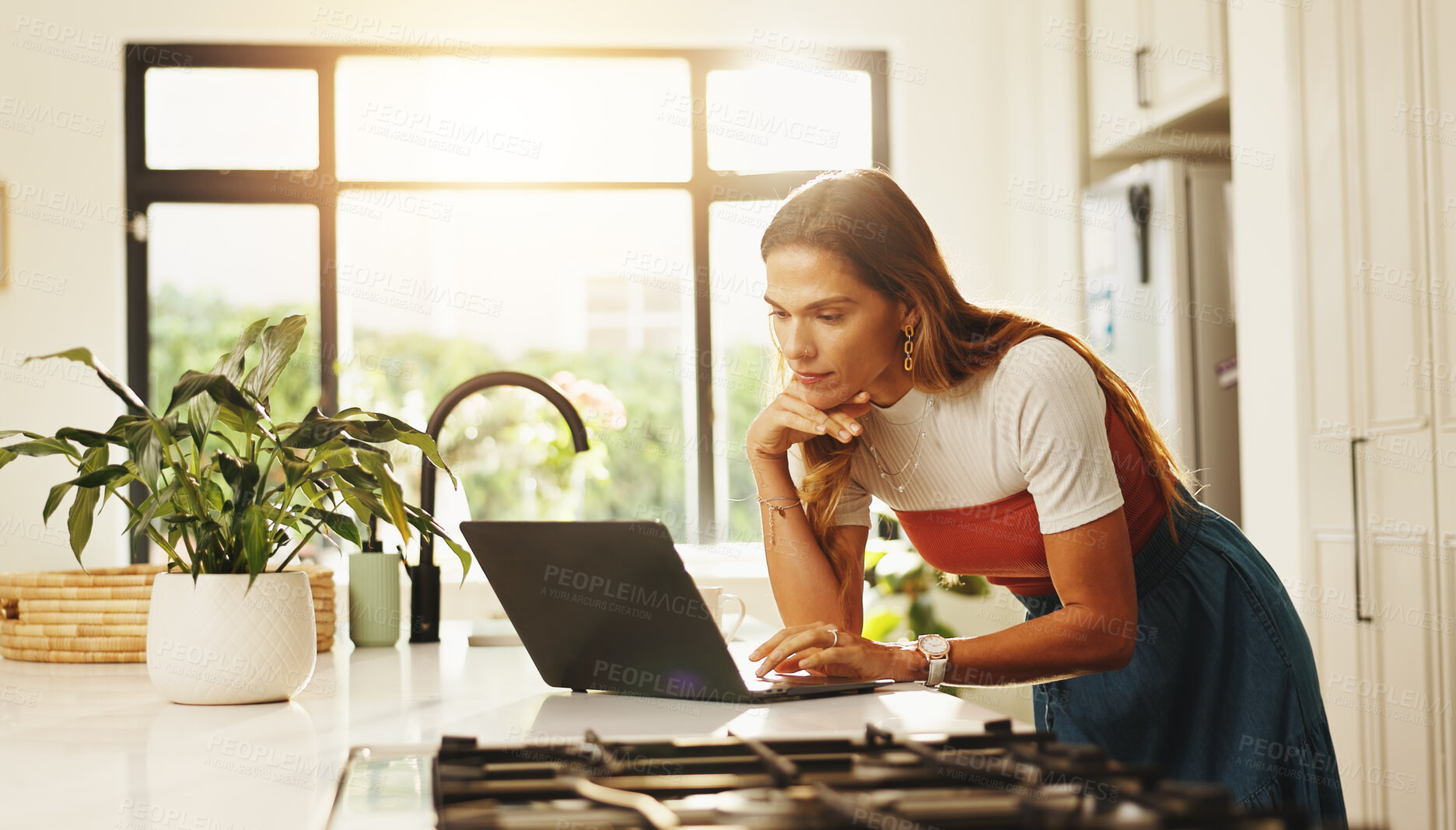 Buy stock photo Typing, laptop and woman in kitchen, home and planning for blog on social media, online or creative. Apartment, writer and person with tech for post on website, blogger and remote work in house