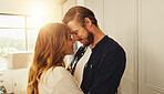 Home, forehead and couple with love, smile or bonding together with happiness, romance or trust. Apartment, lens flare or man with woman, relationship or marriage with kindness, commitment or support