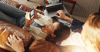 Buy stock photo Laptop, phone and couple relaxing on sofa in home with research, social media or network. Computer, cellphone and man with woman in living room for connectivity, contact or communication from above.