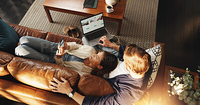 Buy stock photo Laptop, phone and top view of couple on sofa for relax, chill and internet for bonding in home. Dating, relationship and man with woman on tech for social media, website and connection on weekend