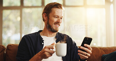 Buy stock photo Coffee, sofa and man with phone in home for social media, online networking and chat on mobile app. Weekend, happy and person with drink on smartphone for internet, contact and message notification