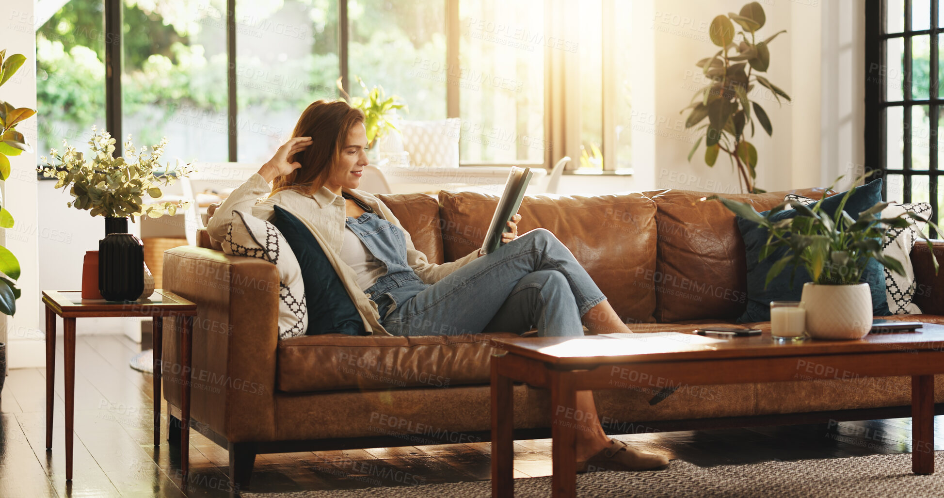 Buy stock photo Tablet, smile and woman relax in home for streaming movie, show and watch drama online. Technology, happy person and reading ebook on internet in living room, news and check social media on weekend