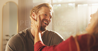 Buy stock photo Home, love and couple with smile, funny and bonding together in living room. People, apartment and man with woman, relationship and joke with support, marriage and romance with affection or laughing