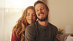 Smile, couple and embrace in home for love, care and support with partner. Happy man, woman and connection in living room for healthy relationship, loyalty and commitment for marriage together