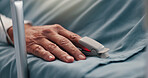 Hand, pulse oximeter and senior patient in hospital bed for recovery of surgery or treatment. Healthcare, healing and elderly person with medical tool to monitor blood oxygen levels in clinic.