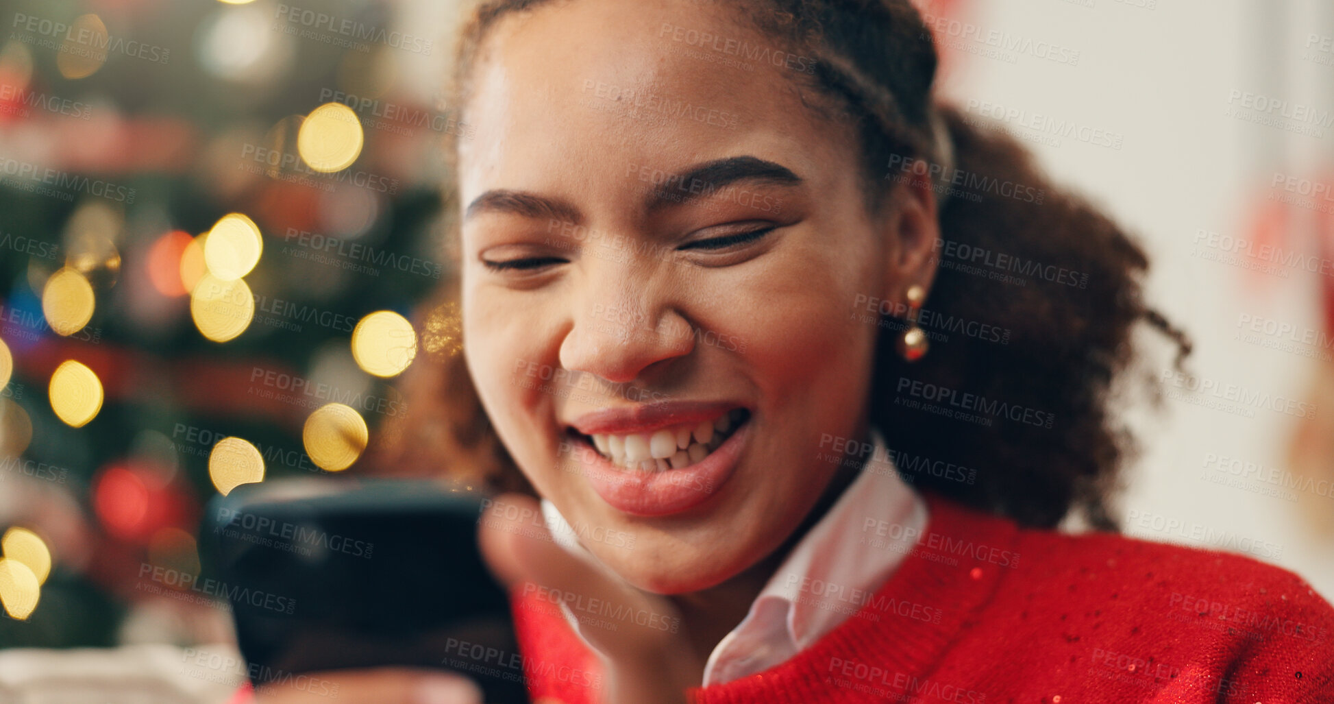 Buy stock photo Christmas, phone and smile of black woman in living room of home for online shopping or retail. App, browsing and social media with happy person in apartment to purchase gift or present on internet