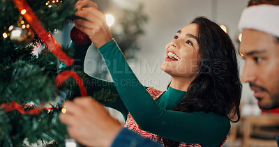 Buy stock photo Christmas, smile and couple with tree, help and bonding together with love, home and relationship. Happy people, apartment and man with woman, Xmas and marriage with celebration, tradition or festive