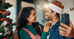 Happy couple, christmas and home with tree for selfie, picture or December memory together. Man, woman or lovers with smile, photography or capture moment for festive holiday or new year celebration