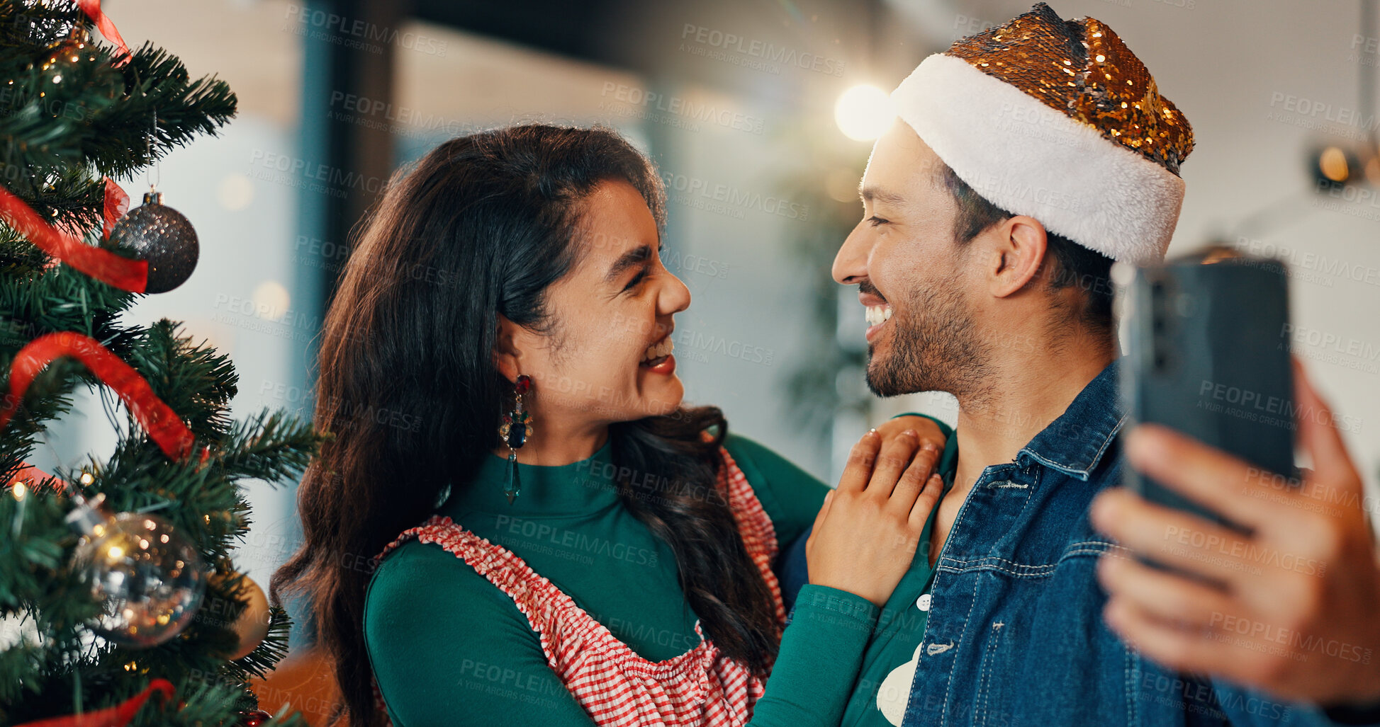 Buy stock photo Happy couple, christmas and home with tree for selfie, picture or December memory together. Man, woman or lovers with smile, photography or capture moment for festive holiday or new year celebration