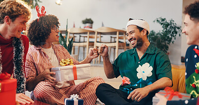 Buy stock photo Home, friends and fist bump for present on Christmas, festive celebration or bonding with thank you. Happy people, men and gratitude with hand gesture for gift, holiday tradition and excited in house