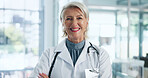 Happy woman, mature doctor and portrait in healthcare profession with help, advice and expert at hospital. Confidence, about us and physician for medical care, health and wellness for smile at clinic