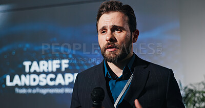 Buy stock photo Man, speaker and mic for speech at conference for tariff landscape of international trade. Person, public speaking and talking for tax rates on imported products, foreign exchange and local economy