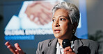 Mature woman, mic and presentation for environment on stage, governance and speech at convention. Person, speaker and discussion for global sustainability, info and accountability at conference