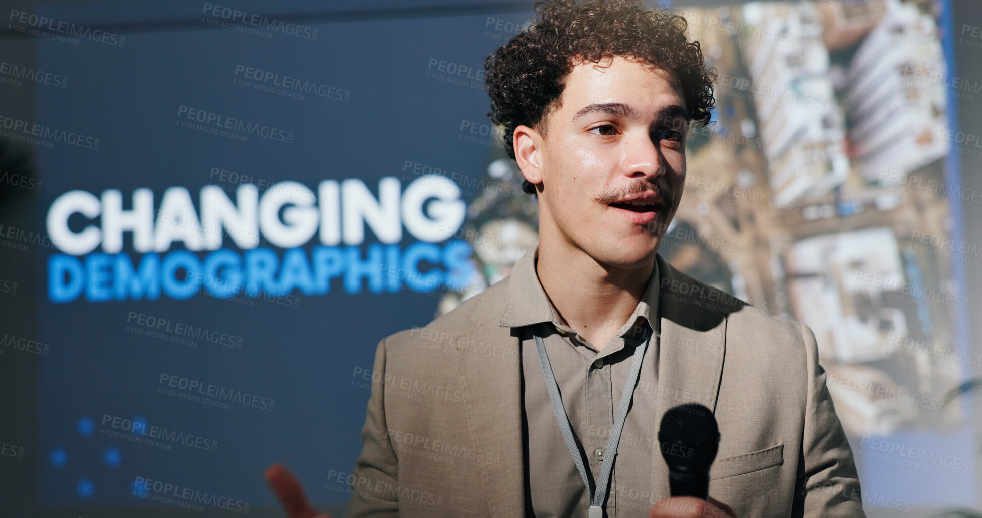 Buy stock photo Microphone, seminar and speech with man in auditorium for presentation on changing demographics. Business, symposium and tradeshow with guest speaker on podium or stage for population transformation