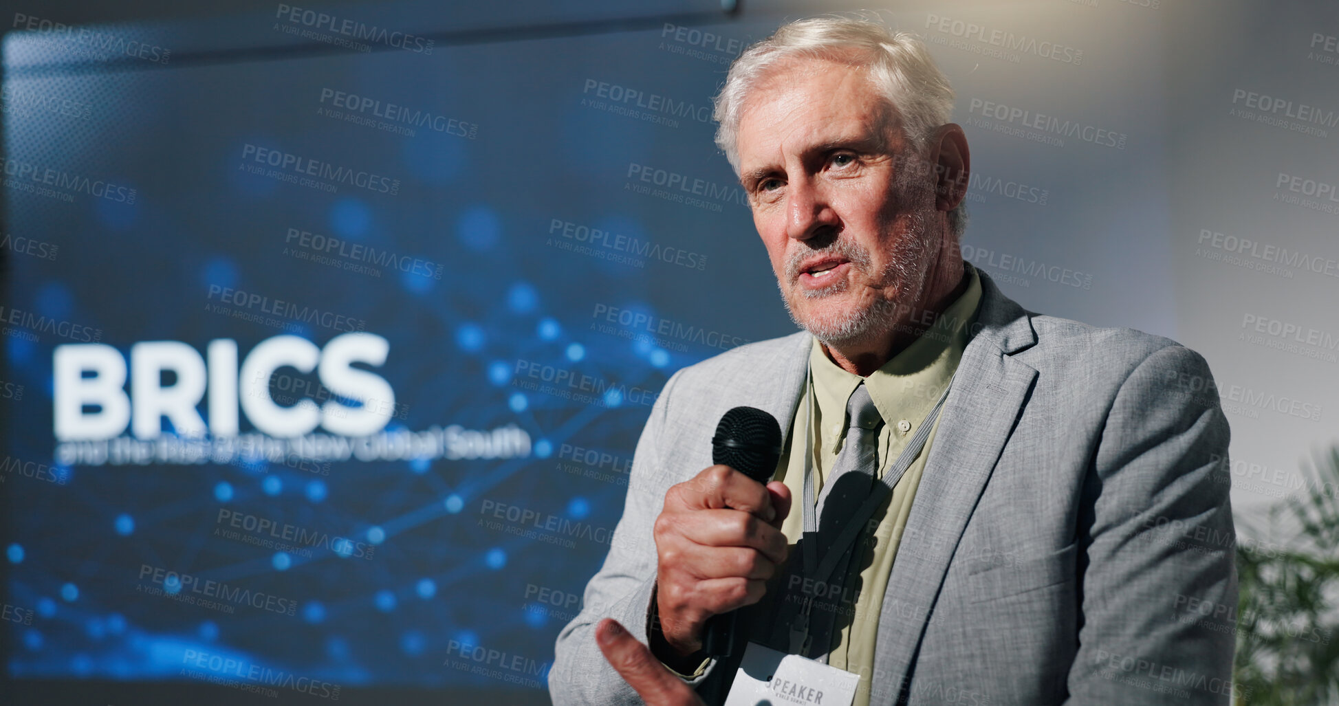 Buy stock photo Mature, businessman and presentation with mic at seminar for discussion on global organization. Man, speaker or executive for government speech for BRICS convention or tradeshow at corporate summit