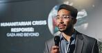 Man, speech and mic at seminar event for genocide, humanitarian crisis and response. Person, public speaking and raise awareness for global oppression, stop injustice and action for war in Palestine