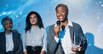 Buy stock photo Women, award and mic on conference stage, happy and giving prize for performance at company. Person, staff and trophy at event with thanks, goal and smile for reward with success in finance career