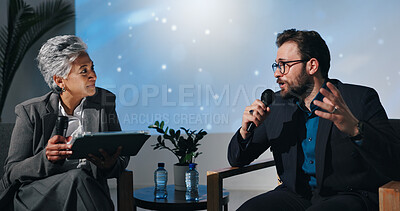 Buy stock photo Presentation, guest and people with mic, talking and businessman with investment strategy and ideas. Chat, host and woman with tablet for questions, conversation and listening to entrepreneur in show