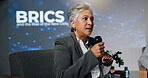 Mature woman, conference or presentation for public speaking, development seminar or business event. Convention, speech and workshop for economy talk in auditorium with microphone, keynote and summit