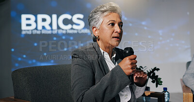 Buy stock photo Mature woman, conference or presentation for public speaking, development seminar or business event. Convention, speech and workshop for economy talk in auditorium with microphone, keynote and summit