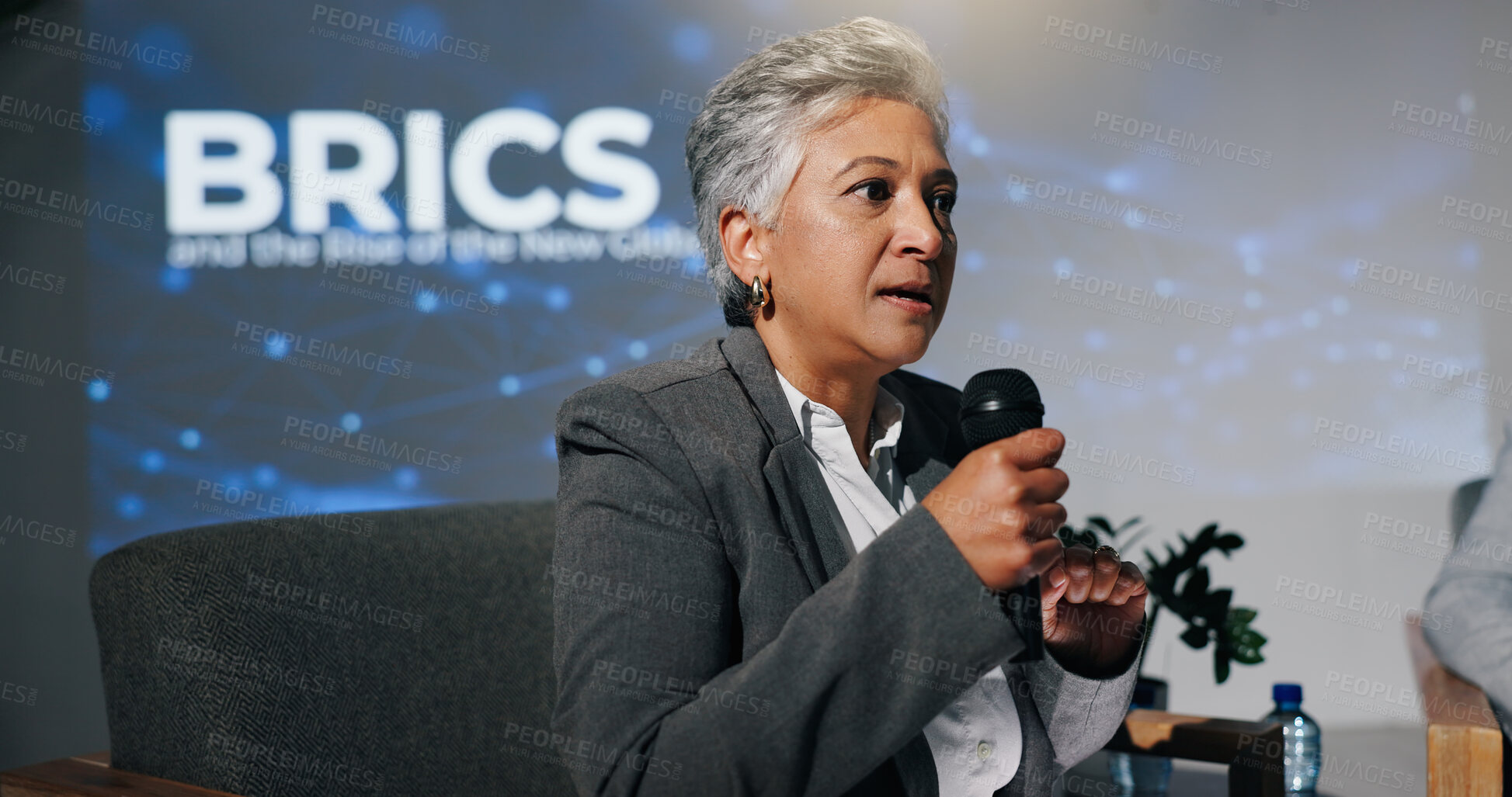 Buy stock photo Mature woman, conference or presentation for public speaking, development seminar or business event. Convention, speech and workshop for economy talk in auditorium with microphone, keynote and summit