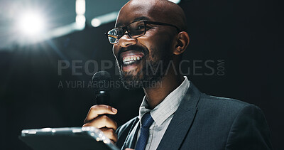 Buy stock photo Microphone, speech and tablet with business black man at symposium for announcement or development. App, event and stage with happy African speaker in auditorium for coaching or training conference
