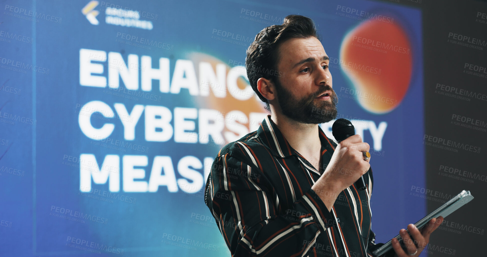 Buy stock photo Businessman, presentation or seminar with tablet or mic for speech or cybersecurity convention. Man, employee or speaker with technology display for online safety measures or tradeshow at tech summit
