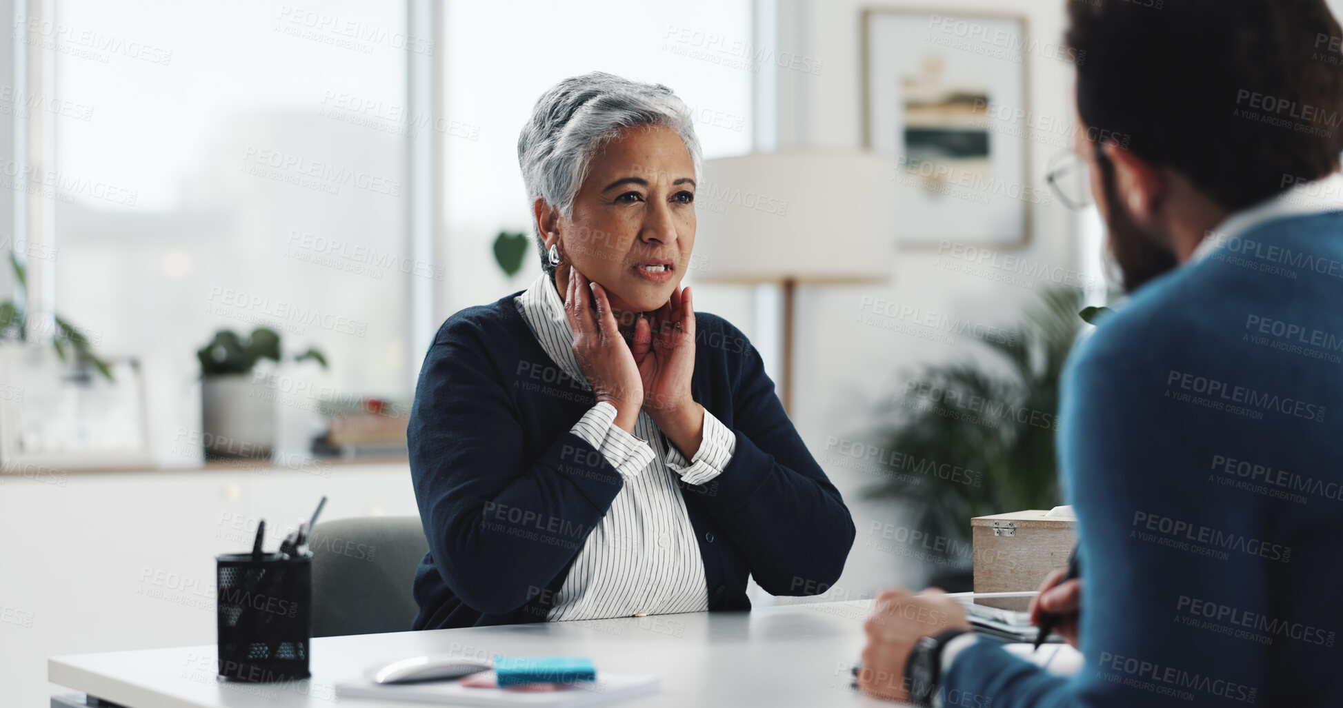 Buy stock photo Medical appointment, woman and explaining symptoms to doctor, help and old patient with sore throat. Hospital, discomfort and elderly person with thyroid nodule, consultation or talking to specialist