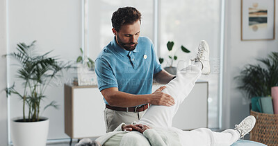 Buy stock photo Physiotherapist, patient and stretching legs at clinic for injury, healing and care for wellness. People, recovery and support with guide, advice and help for knee pain, arthritis for rehabilitation