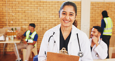 Buy stock photo Doctor, clipboard and portrait of happy woman in community center for notes, charity or healthcare. Medical worker, smile and professional at ngo for wellness outreach, humanitarian aid or volunteer