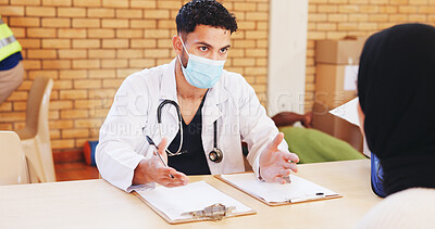 Buy stock photo Patient, consultation and man with mask, doctor and volunteering to control outbreak and healthcare. Nonprofit, people and medical professional with protection for MERS CoV, diagnosis or treatment