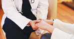 Holding hands, support and person with doctor for comfort for diagnosis, help and counseling. Healthcare, hospital and patient with health worker for medical service, consulting and empathy in clinic