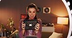 Home, live stream and woman with product review, influencer and promo for fans on website or online. Night, brand ambassador and person with bag for followers, ring light and video on social media