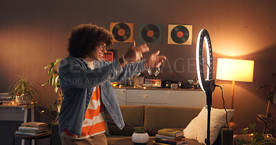 Buy stock photo Man, influencer and dancing with ring light at house for introduction, late live streaming and social media. Night, content creator and audition for audience, filming video and tutorial challenge