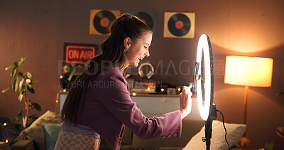 Buy stock photo Influencer, happy and woman in home with ring light for social media, recording video and late upload. Content creator, night and excited with audience for live streaming, subscription and broadcast