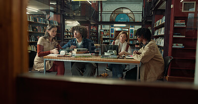 Buy stock photo Talking, books and group of students studying in library for university test, project or exam. Knowledge, notes and friends preparing for college assignment together with scholarship at campus.