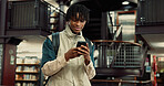 Phone, happy and black man in university library with contact, networking or email for scholarship. Smile, connectivity and African student with cellphone for communication on mobile app at college.