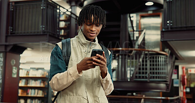 Buy stock photo Phone, happy and black man in university library with contact, networking or email for scholarship. Smile, connectivity and African student with cellphone for communication on mobile app at college.