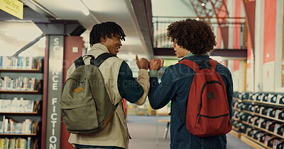 Buy stock photo Library, students and friends with fist bump for motivation, greeting and bonding with education. Back, men and people with hands gesture for welcome, support or trust for studying in college campus