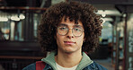 College student, serious or man with portrait in library for night study, education or learning. University, person or backpack on campus for essay deadline, exam preparation or academic productivity