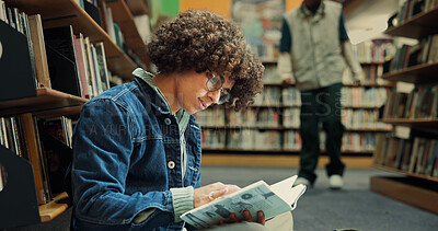 Buy stock photo Library, student and education with book for reading, assignment research and knowledge in college. University, male person and man with studying for thesis, literature and learning for exam on floor