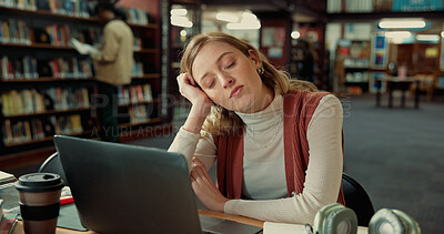 Buy stock photo College student, tired and sleeping with laptop in library for study fatigue, burnout or overworked. Education, rest and girl with nap on campus for academic exhaustion, low energy or workload stress