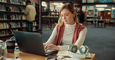 Buy stock photo Student, woman and typing on laptop in library for education, learning or notes revision in college. University, computer and girl on internet to research assignment, studying or test preparation
