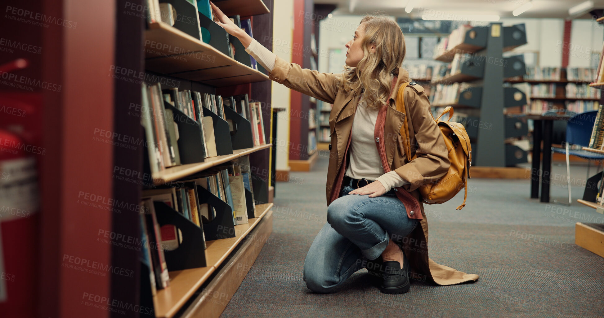 Buy stock photo Student, university and woman in library, search and books with education, research and study. College, shelves and person with scholarship, knowledge and assignment with hobby, decision and learning