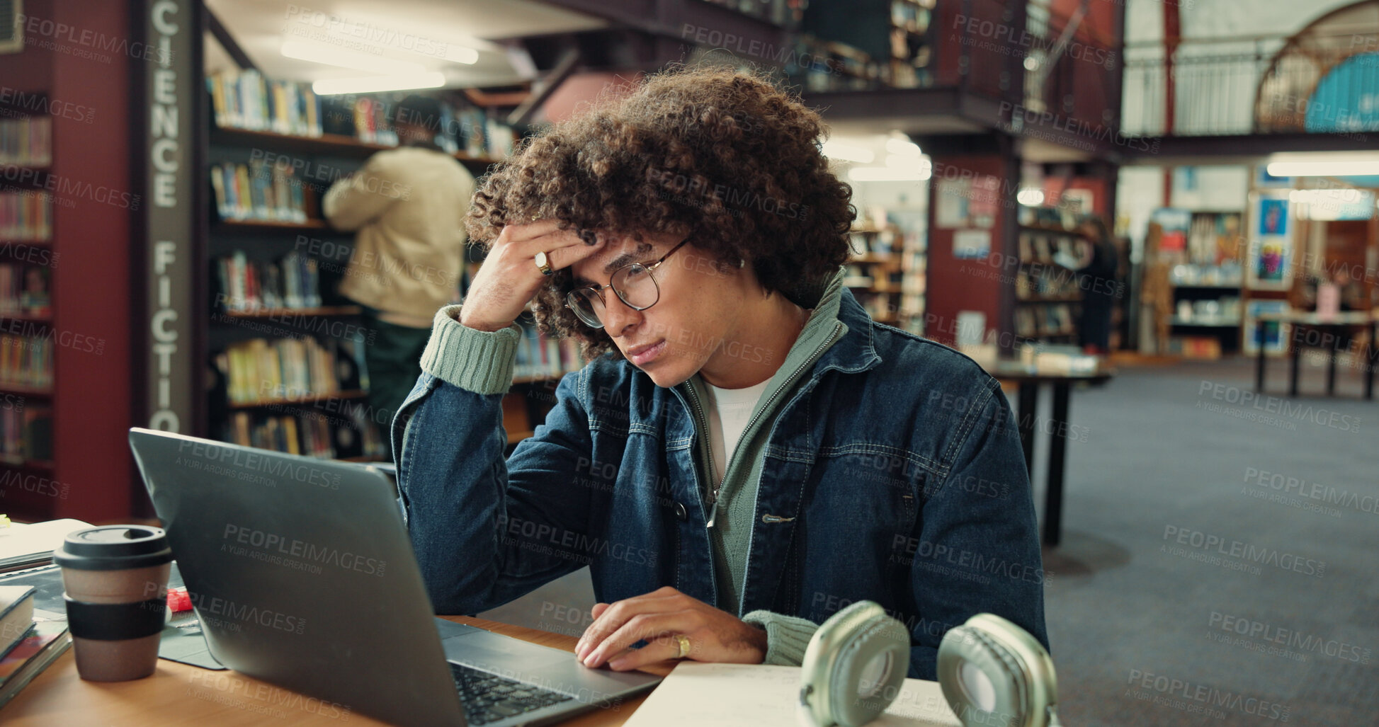 Buy stock photo Laptop, tired and man with headache in library for exam pressure, fatigue or pain in college. University, stress and sick student with migraine on computer, burnout and brain fog with thesis deadline