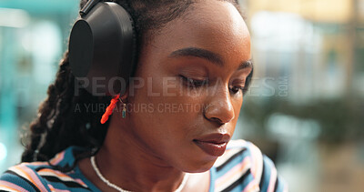 Buy stock photo Thinking, student and woman with headphones for project, learning or studying for school test. University, college and African person brainstorming and listen to music, audio or podcast for education